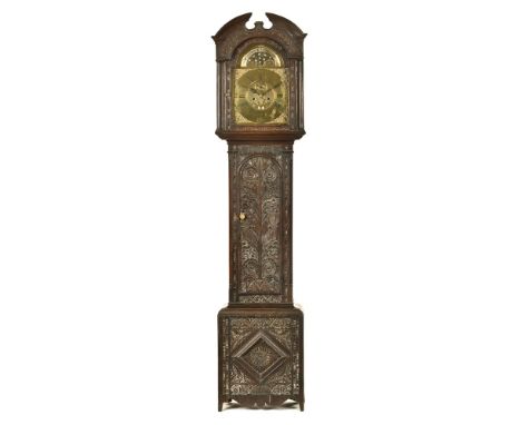 A part 18th century oak carved longcase clock, with eight day movement, bears date 1683.  216 cm high.