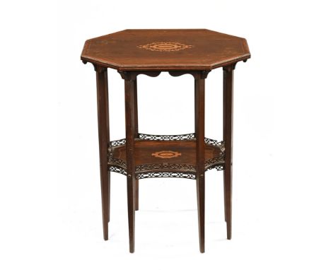 An Edwardian inlaid rosewood octagonal occasional table, with shelf and raised on eight legs of tapered square section.