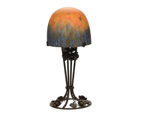 Muller Frere Art Nouveau, amber and blue coloured table lamp with wrought iron base, signed on the glass shade.  59 cm high. 