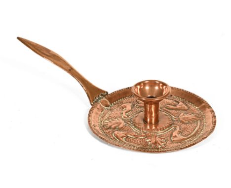 An Arts & Crafts John Pearson copper chamber stick, with circular pan and detachable sconce stamped with incised mark J.P. to