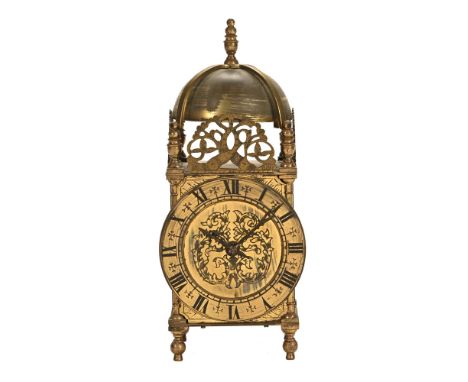 A lantern type mantel clock.  Height 24 cm, width 9 cm, depth 9 cm.