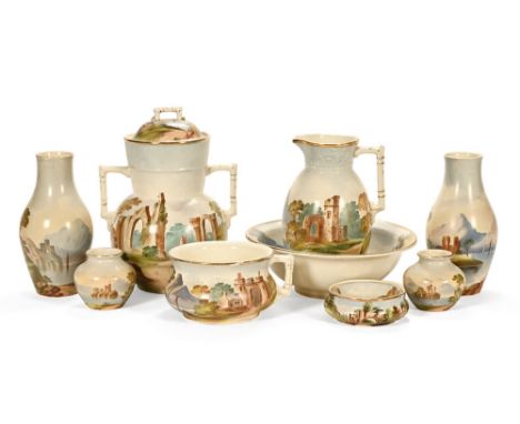 An extensive Edwardian ceramic wash set, comprising pail, jug, basin, chamber pot, two squat vases, two soap dishes, a lidded