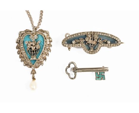 A silver heart shaped enamel and paste necklace, with silver chain, together with a silver coloured metal key and bar brooch.