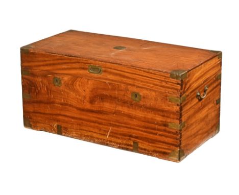 A 19th century camphorwood brass bound military trunk.  Height 50 cm, width 105 cm, depth 52 cm.  (see illustration).