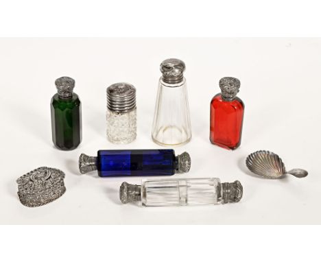 A Victorian silver pill box, together with six silver topped scent bottles and a shell shaped caddy spoon.   CONDITION REPORT