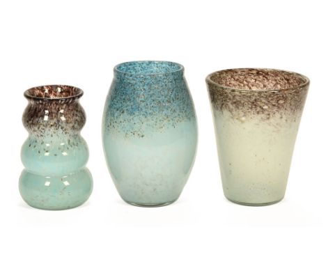 A collection of three Monart glass vases, all with light blue ground colours, mottled effects and aventurine inclusions.  Tal