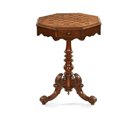 A Victorian mahogany octagonal chess table, with inlaid top, two opposing frieze drawers above a turned support on carved tri