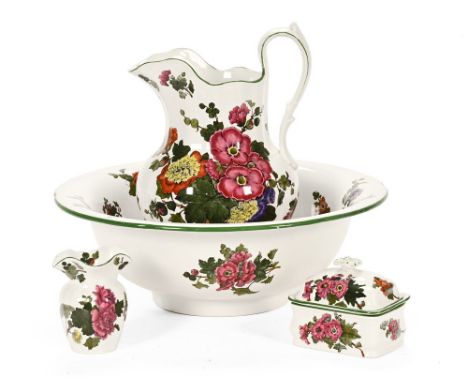 An Edwardian Spode ceramic wash set, comprising toothbrush holder, soap dish with lid, jug and basin, all with bright floral 