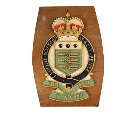 A Royal Army Ordnance Corps cast iron wall plaque.  Height 59 cm, width 36 cm, mounted on a wooden board.  (see illustration)