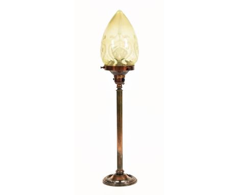 An early 20th century brass table lamp, having Vaseline glass Art Nouveau shade on reeded column and circular base.  Height 4