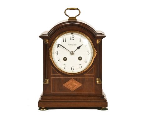 Cameron & Son Kilmarnock an Edwardian mahogany inlaid cased mantel clock, with brass handle and enamelled dial, the case with