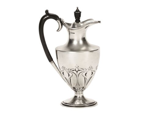 An Art Nouveau silver coffee pot, by James Deakin & Sons Sheffield 1905, repousse with a stylised motif.  373 grams.  Height 