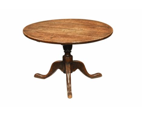 A 19th century mahogany low circular occasional table, with column support and outswept tripod base.  51 cm high, 77 cm diame