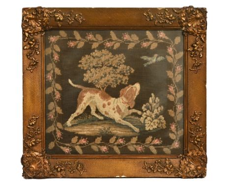 British School circa 1900, a framed tapestry of a hunting dog in a woodland setting within a gilt composite frame.  36 x 39 c