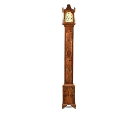 A late 19th century slim longcase clock, with wooden dial and single train movement in inlaid case.  Height 197 cm, width at 