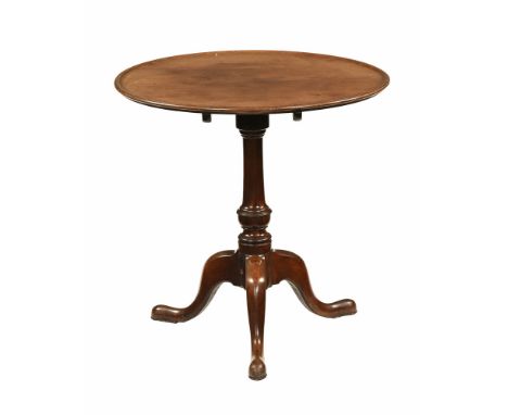 A 19th century mahogany round tilt top occasional table, with barrel support and tripod legs with pad feet.  69 cm high.