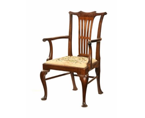 A George III mahogany carver dining chair, with turned cresting rail, shaped arms, a drop in tapestry seat and front cabriole