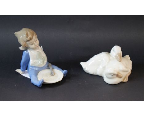 Nao, two ceramic figures "Bebe Con Lato De Papilla, 01074" and "Dos Patitos, 00368". Each boxed CONDITION REPORT; Each figure