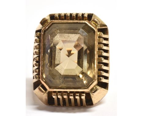 BROWN QUARTZ STATEMENT RING The single step cut stone measuring approx 1.7 x 1.5cm in a raised open work mount, the yellow me
