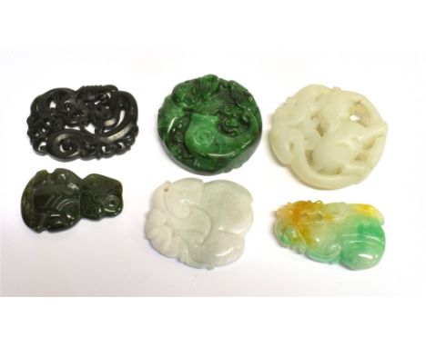 TWO CHINESE JADE TYPE CARVINGS  a Maori Tiki pendant and three further carvings, largest item approx 5cm diameter Condition R