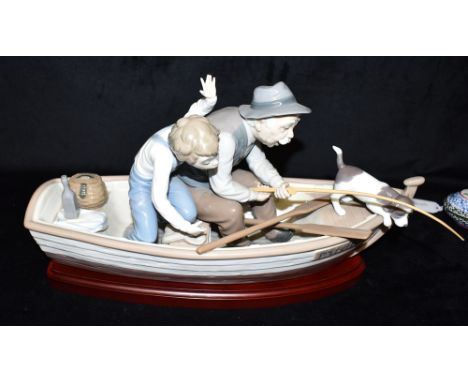 A LARGE LLADRO GROUP MODEL 5152  'Fishing with Gramps/Paloma', on wooden stand Condition Report : good condition, no damage C