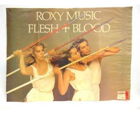 POP MEMORABILIA - ROXY MUSIC  A promotional poster for the album 'Flesh + Blood' (1980), with an attached concert ticket, Wem