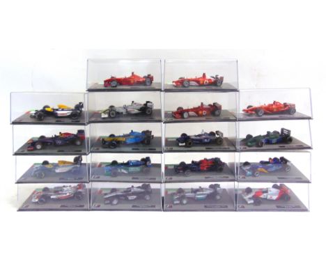 EIGHTEEN 1/43 SCALE DIECAST MODEL FORMULA 1 RACING CARS  each mint or near mint and boxed.