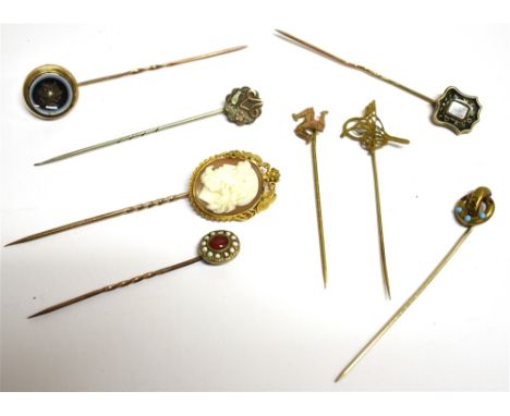 EIGHT VICTORIAN AND LATER STICK PINS (BOXED) The stick pins in a variety of materials to include a seed pearl set bulls eye a