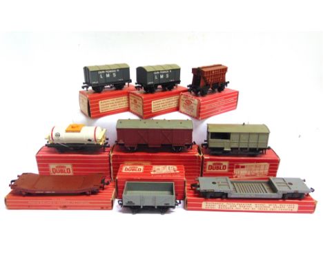 [OO GAUGE]. NINE HORNBY DUBLO WAGONS  comprising two No.4313, Gunpowder Vans (both repainted L.M.S. grey); No.4675, Tank Wago