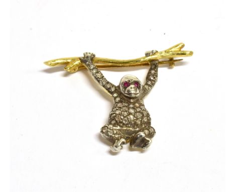EDWARDIAN ERA GEM SET SWINGING MONKEY BROOCH The monkey with the front set in white metal, rubelite eyes and body set in whit