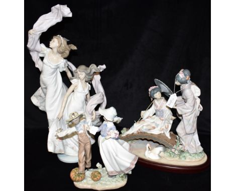 THREE LLADRO GROUPS:  model 1445 'Springtime in Japan' with stand, model 5819 'Allegory of Liberty', model 5385 'Scarecrow an