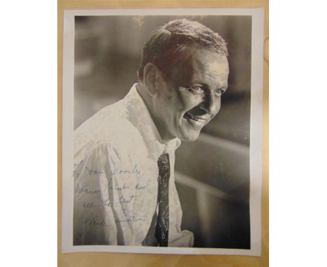 AUTOGRAPH - FRANK SINATRA (AMERICAN, 1915-1998), SINGER &amp; ACTOR  A black and white portrait photograph signed in blue ink