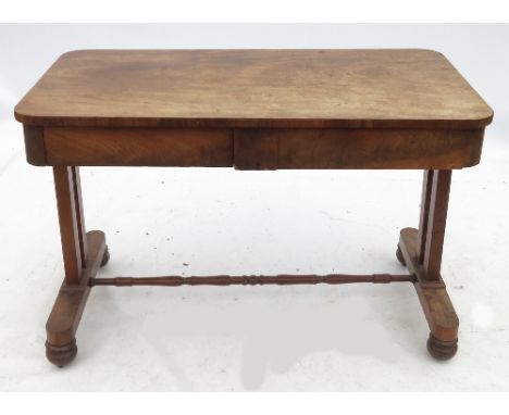 A 19th century mahogany writing table, fitted two frieze drawers, raised on two square legs at each end united by a stretcher