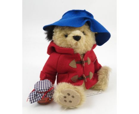 A modern Steiff Paddington Bear, with blue hat, red jacket and pot of marmalade, circa 2007