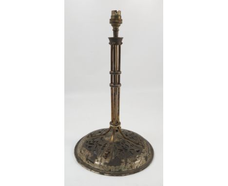 A Birmingham Guild of Handicrafts brass table lamp, the central cluster column formed as four cylindrical supports, raised on