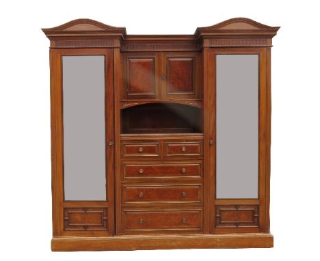 A walnut and burr walnut wardrobe, having two mirror doors flanked by two blind cupboards over a shelf, with a central bank o