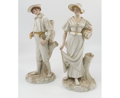 A pair of Royal Worcester Hadley figures, in white with gilt, of a woman holding a costrel, and a man, both standing by tree 