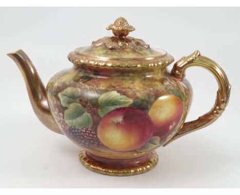 A Royal Worcester tea pot, hand painted all around with fruit to a mossy background by Skerrett, height 6.5ins
