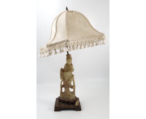 An Eastern carved stone figure, formed as a table lamp, height 13ins 