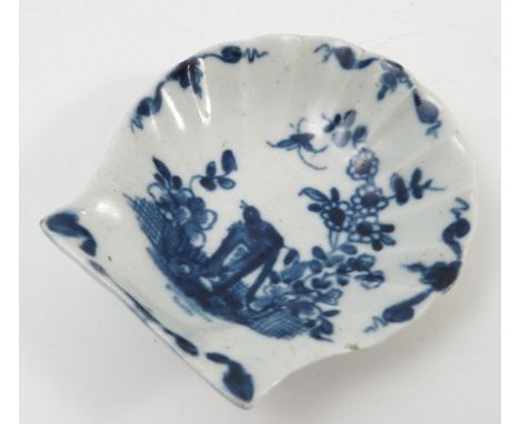 A first period Worcester shell moulded pickle dish, painted in underglaze blue with the Two Peony Rock Bird pattern, workman`