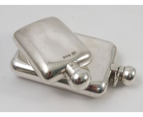 A silver hip flask, with twist hinged cover, of rectangular form, London 2003, weight 5oz, together with another smaller hip 