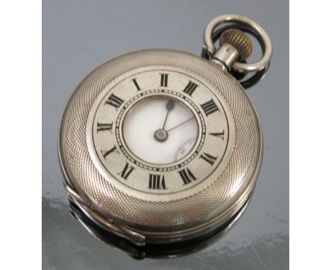 A silver half hunter pocket watch, the white enamel dial with black Roman numerals, hands and subsidiary seconds dial, the th