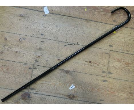 A coloured glass walking stick, with loop handle, height 31ins 