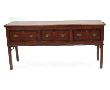 A 19th century oak dresser, fitted three cross banded drawers to the bases, raised on square legs with fret cut corners, widt