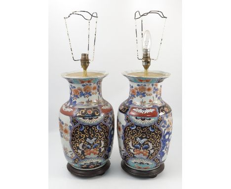 A pair of Imari vases, converted to lamp bases, of baluster form decorated with flowers, height 16ins 