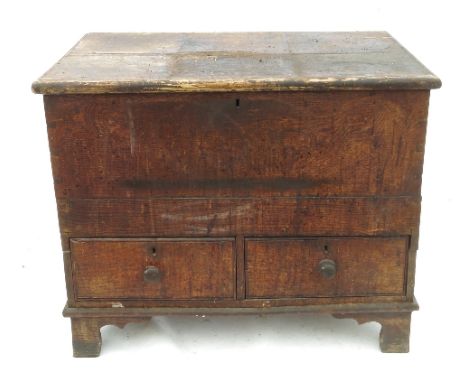 A small Antique oak mule chest, with rising lid fitted two drawers below, raised on bracket feet, width 37ins