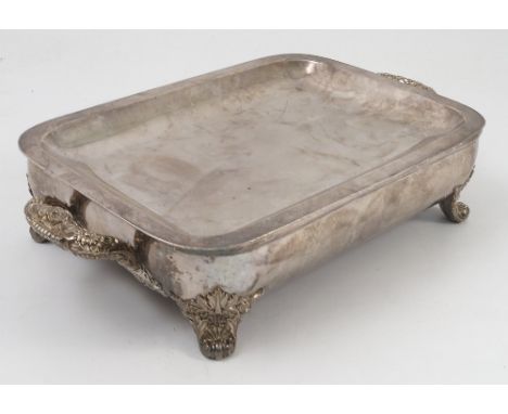 A rectangular silver plated warming dish, engraved with a coat of arms, having four knurl feet and carrying handles, width 40
