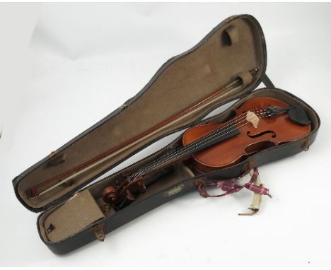 A cased violin, with two piece back, bearing label 'Copie de Antonius Stradivarius, Cremonenfis', length of back including bu