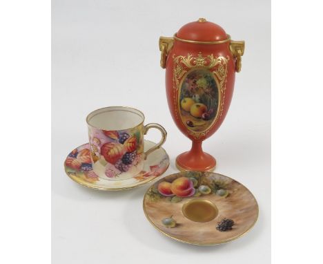 A Royal Worcester covered pedestal vase, with orange ground, the oval reserve hand painted with fruit to a mossy background b