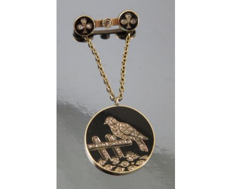 A rose diamond and enamel Continental pendant, to a brooch fitting, the circular panel with a rose diamond set image of a bir